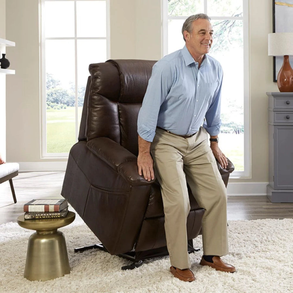 Lifestyle image of a man safely standing up with the reliable assistance of the Golden Rhea PL442 lift chair.